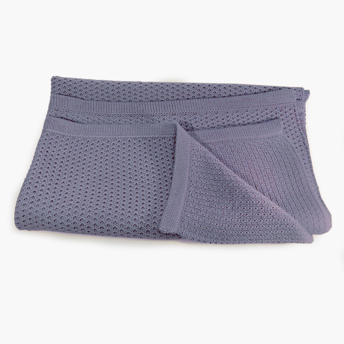 Lilane Babydecke im Doubleface-Lochmuster gestrickt, aus feinster Bio-Merinowolle. Die Decke mißt ca 75x80cm.