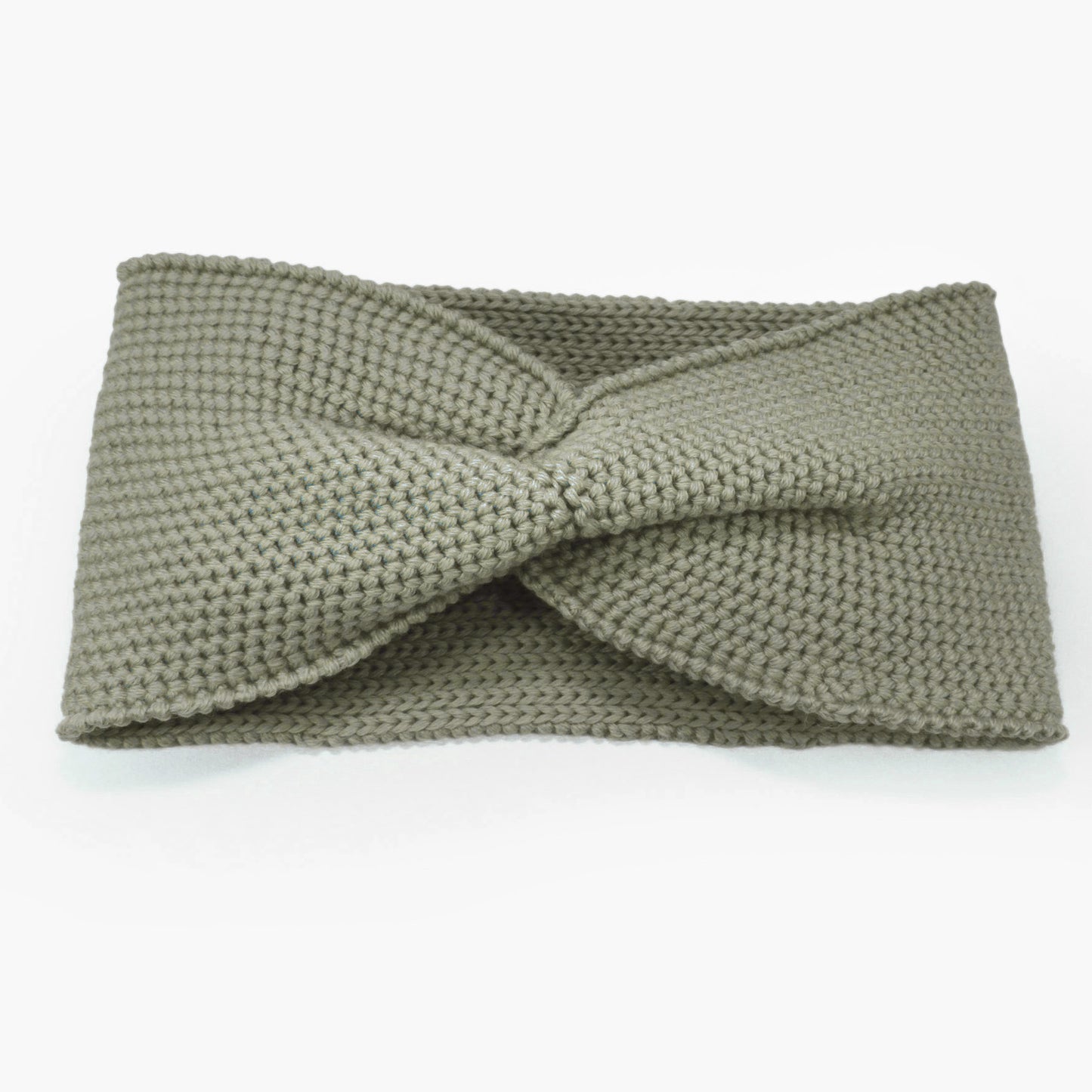 Mintgrünes Stirnband mit einer Turban-ähnlichen Verdrehung. Gestrickt im Doubleface Patentmuster, außen Knötchenstruktur und Innen sieht es wie ein klassisch rechts gestricktes Muster aus.