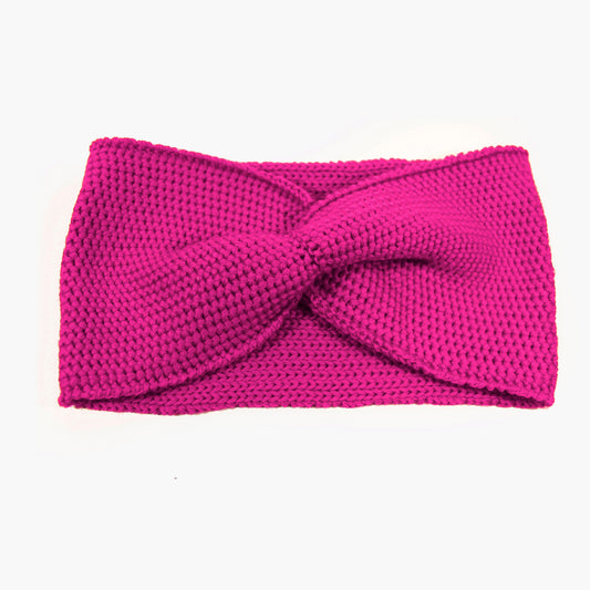 PinkesStirnband mit einer Turban-ähnlichen Verdrehung. Gestrickt im  Doubleface Patentmuster, außen Knötchenstruktur und Innen sieht es wie ein klassisch rechts gestricktes Muster aus.